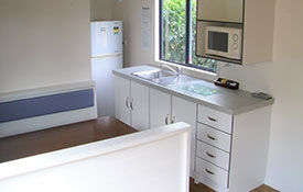 self-contained 1-bedroom cabin kitchen
